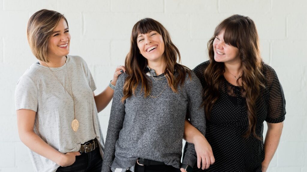 image of three smiling women