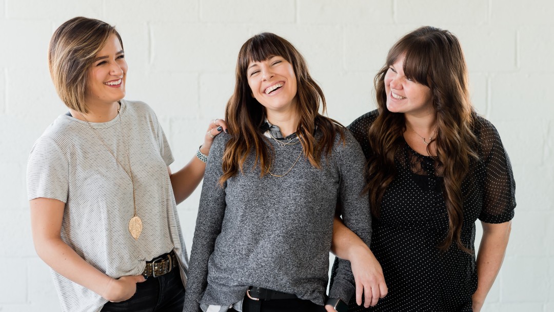 image of three smiling women