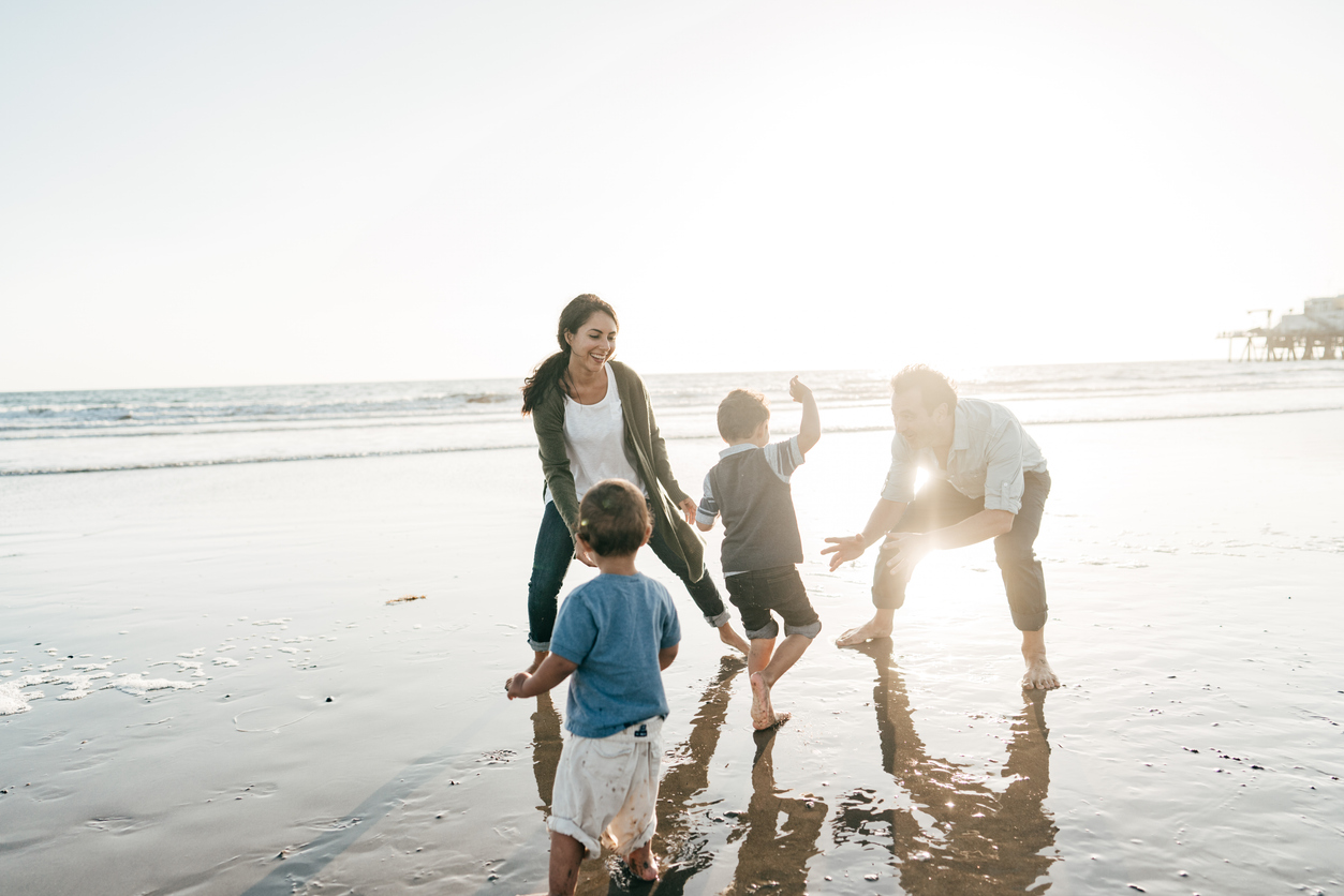 kids on spring break with their parents are the beach.