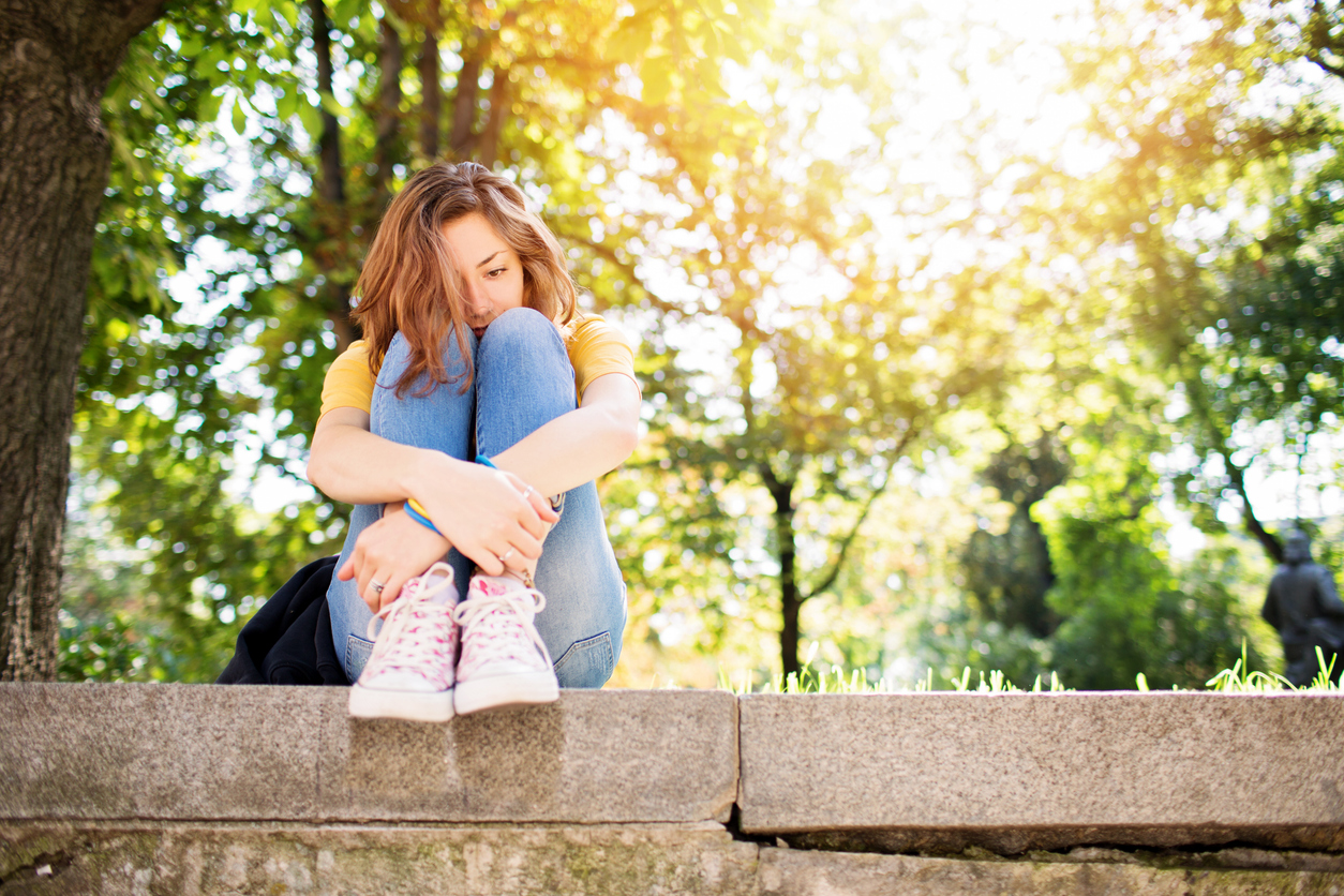 teen girl with anxiety in spring.